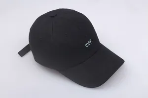 Close-up of black baseball cap with blue and white OFF embroidery and power icon