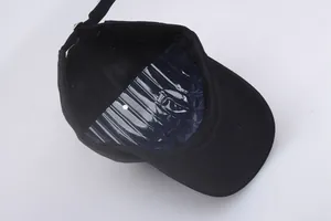 Detail of the black baseball cap interior with a plastic form to maintain the crown shape