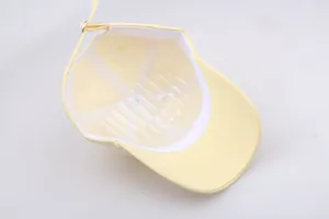 Detail view of baseball cap interior with white sweatband and adjustable metal buckle