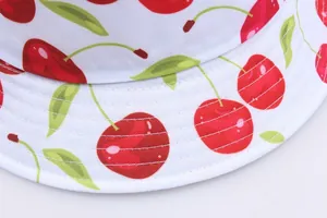 White cotton bucket hat with cute red cherry prints and reinforced stitched brim