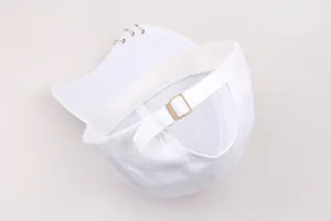 Detail of white cotton baseball cap showing metal rings on brim and adjustable buckle