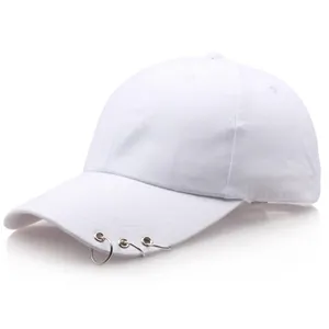 Minimalist white baseball cap featuring three silver metal rings on a curved brim