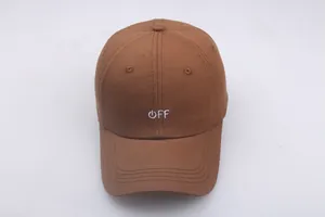 Close-up of brown cotton baseball cap with white OFF embroidery and reinforced stitching