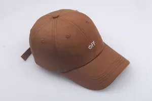Close-up of brown cotton baseball cap featuring white OFF embroidery and power icon
