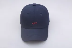Close-up of navy blue baseball cap featuring a red 'OFF' logo and power icon embroidery