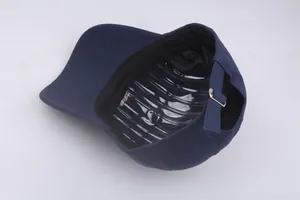 Detail view of navy blue cotton cadet cap showing inner sweatband and metal buckle