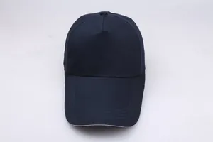 Detail view of reinforced stitching on navy blue cotton canvas visor for baseball cap