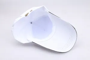 Detail view of white baseball cap interior with metal buckle and sweatband stitching