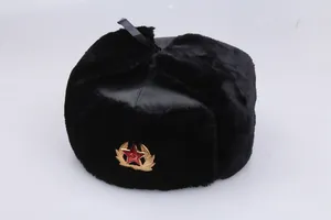 Classic black Ushanka winter hat with ear flaps and a red star metal badge