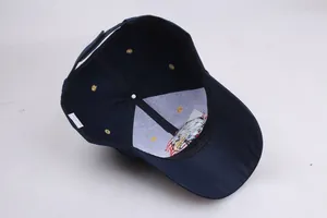 Detail view of the intricate eagle and American flag embroidery inside a navy baseball cap