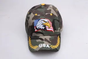 Detail view of American flag eagle embroidery and USA laurel leaves on camo baseball cap