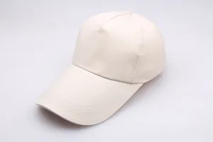 Detail view of cream-white cotton baseball cap with five-panel structure and curved brim