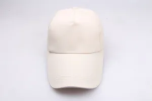 Detail view of beige baseball cap with reinforced stitching on the extended sun brim
