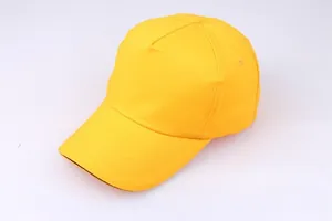 Detail view of a plain yellow 5-panel cotton baseball cap with ventilation eyelets