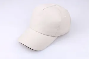 Detail view of a beige five-panel cotton baseball cap with reinforced stitched brim