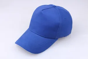 Detail view of royal blue 5-panel cotton baseball cap showing curved brim and texture