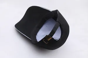 Adjustable black canvas baseball cap with long brim and bronze buckle closure detail