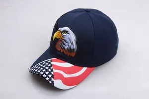 Detailed embroidery of an eagle head on a navy baseball cap with USA flag pattern brim
