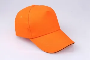 Detail view of orange five-panel cotton baseball cap with parallel stitching on the brim