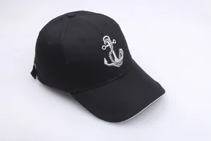 Classic black baseball cap with silver anchor embroidery and white contrast brim detail