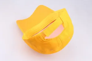 Rear view of yellow cotton baseball cap with adjustable hook and loop strap detail