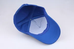 Detailed interior view of navy cotton baseball cap showing white inner lining and stitching