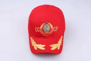 Detail of red CCCP baseball cap with gold Soviet hammer and sickle embroidery on front