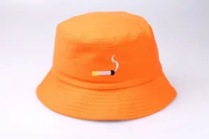 Detail of orange bucket hat featuring high-density cotton canvas and cigarette embroidery