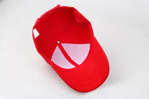 Internal view of a solid red baseball cap showing white support fabric and care label