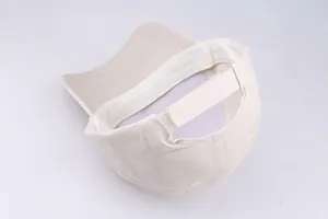 Detail of adjustable strap and internal sweatband on beige cotton baseball cap