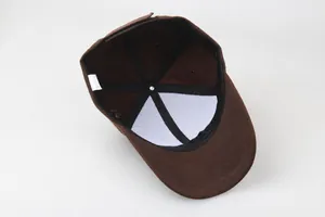 Detailed interior view of a brown cotton baseball cap showing reinforced seams and label