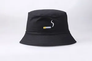 Close-up of cigarette embroidery on a black cotton bucket hat with reinforced brim stitching