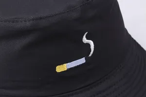 Black cotton bucket hat with detailed cigarette embroidery and street style design