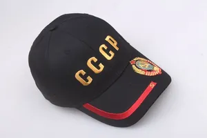 Close-up of golden CCCP embroidery and soviet emblem on a black cotton baseball cap