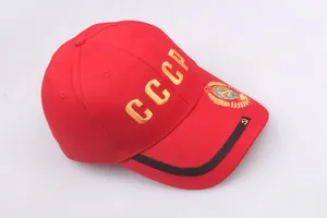 Macro detail of gold CCCP embroidery and emblem on a vintage red Soviet baseball cap