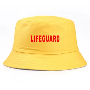 Yellow cotton bucket hat with red Lifeguard print for sun protection in summer