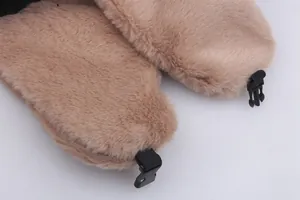 Detailed close-up of soft khaki faux fur ear flaps with adjustable secure buckle strap