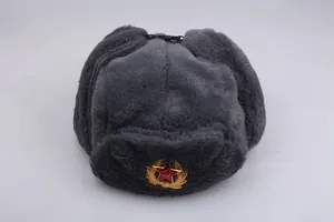 Close-up of thick faux fur Ushanka hat featuring a Soviet Red Star metal badge