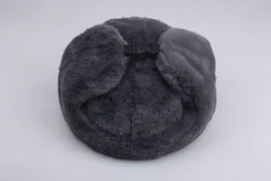 Detailed top view of dark grey faux fur winter hat with adjustable black buckle closure