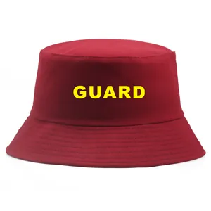 Red cotton bucket hat with yellow GUARD printed letters for casual sun protection