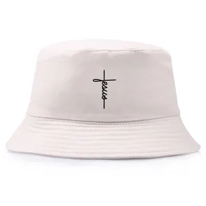 Beige cotton bucket hat featuring a black vertical Jesus cross print design