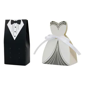 Detail of tuxedo and wedding dress gift boxes featuring a white silk satin ribbon bow