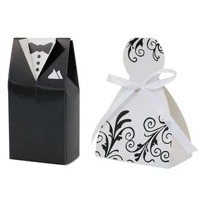 Elegant tuxedo and white gown wedding candy boxes with delicate ribbon and vine details