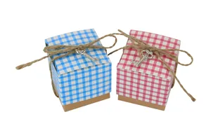Detail of square gingham candy boxes with kraft base, jute twine, and silver key charm