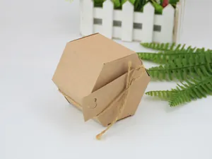Macro detail of hexagonal kraft paper gift box with heart-shaped tag and natural hemp rope