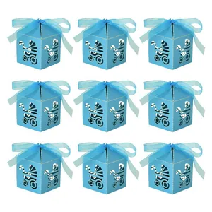 Nine blue laser-cut baby carriage candy boxes with matching ribbons for baby shower parties