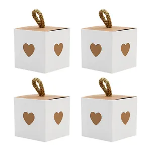 Lot de 4 boîtes cadeaux blanches en kraft avec cœur évidé et poignées en corde rustique