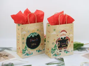 Close-up of Christmas kraft paper gift bags with Santa patterns and red tissue paper