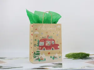Detail of Christmas kraft paper gift bag featuring Santa and vintage red van graphics