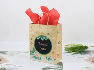 Detail of Merry Christmas kraft paper gift bag with festive illustrations and red tissue paper